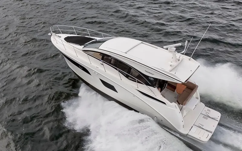 You Betcha Yacht Photos Pics 2016 Sea Ray 400 Sundancer yacht cruising on open water.