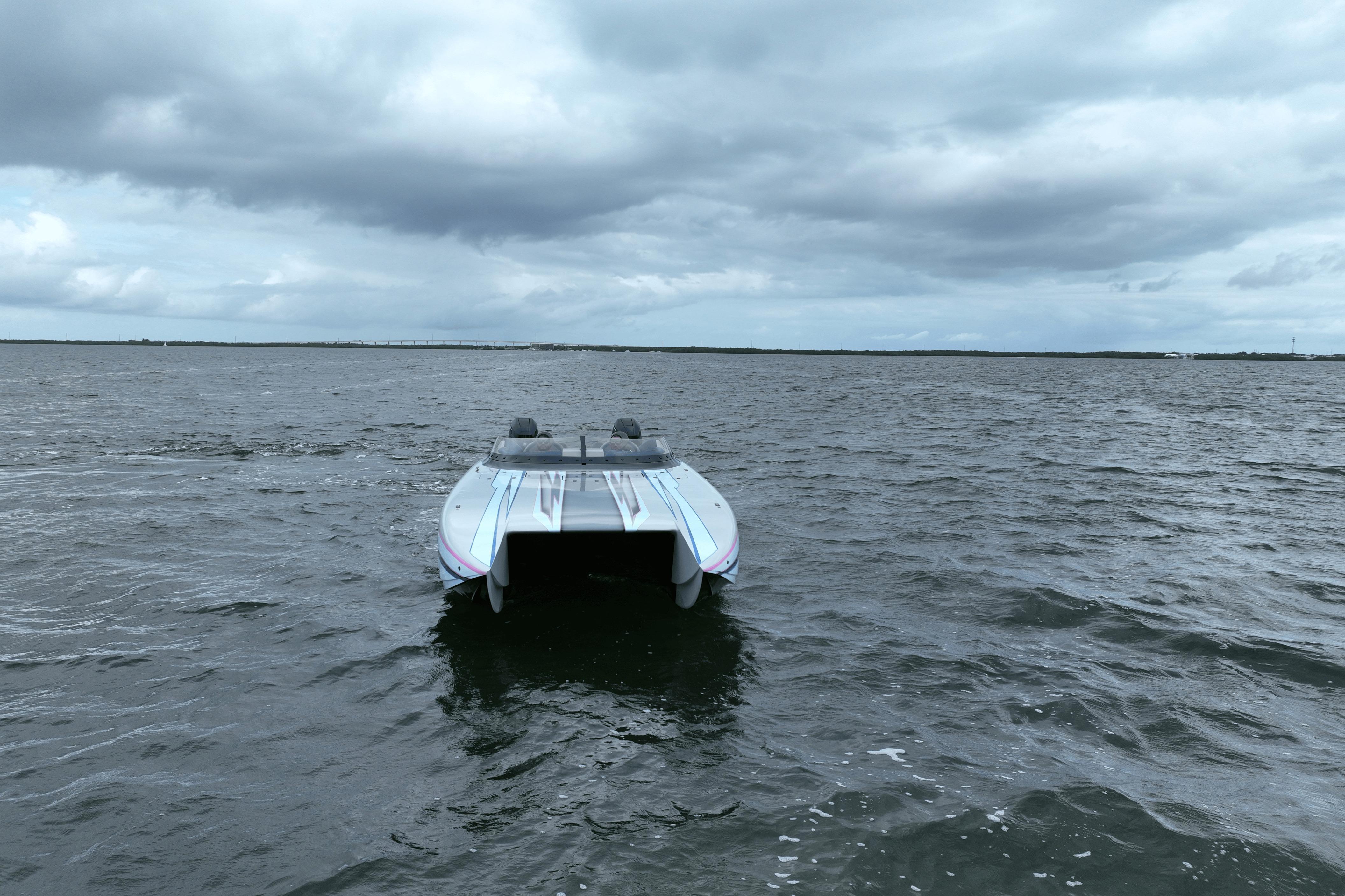 2024 Dug Wright 32 boat on open water under cloudy sky.