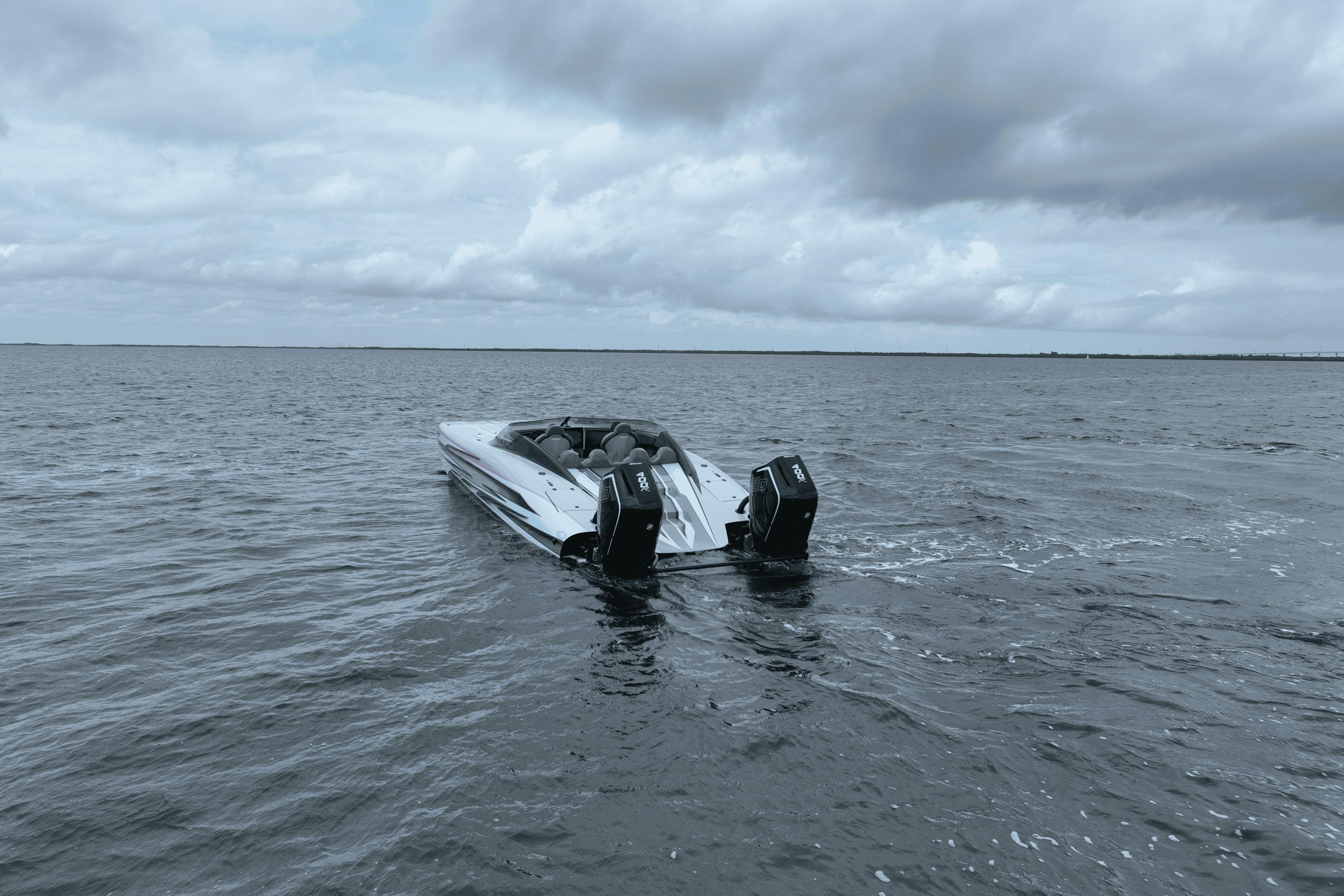 2024 Dug Wright 32 boat on open water under cloudy sky.