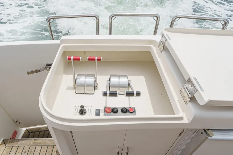 Sweet Seas Yacht Photos Pics Control panel of a 2001 McKinna 57 Pilothouse yacht with throttle levers.