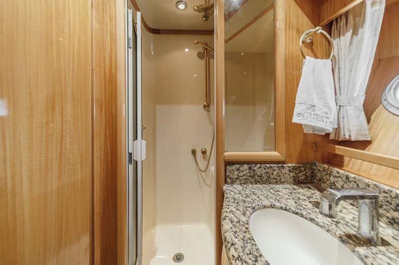 Sweet Seas Yacht Photos Pics Luxurious bathroom in 2001 McKinna 57 Pilothouse yacht with granite countertop and shower.