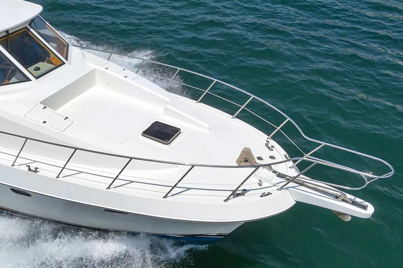 Sweet Seas Yacht Photos Pics 2001 McKinna 57 Pilothouse yacht cruising on open water, showcasing sleek design and elegance.