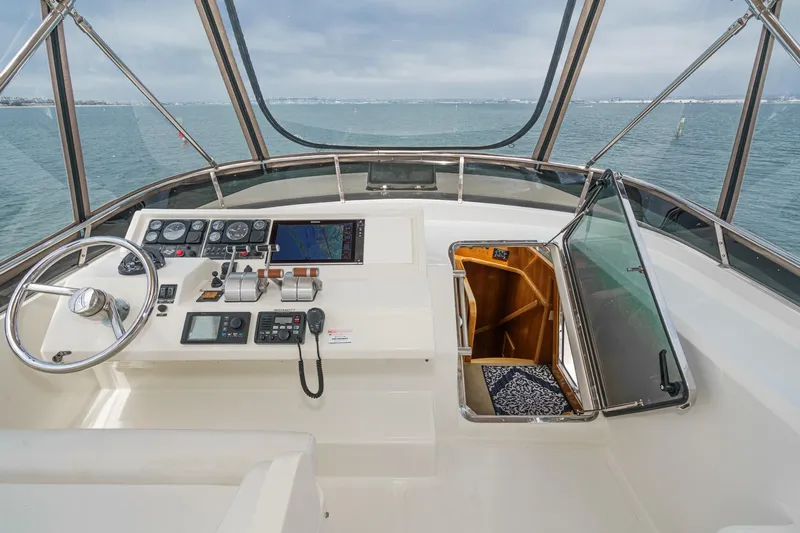 Sweet Seas Yacht Photos Pics Pilothouse of 2001 McKinna 57 yacht with navigation controls and ocean view.