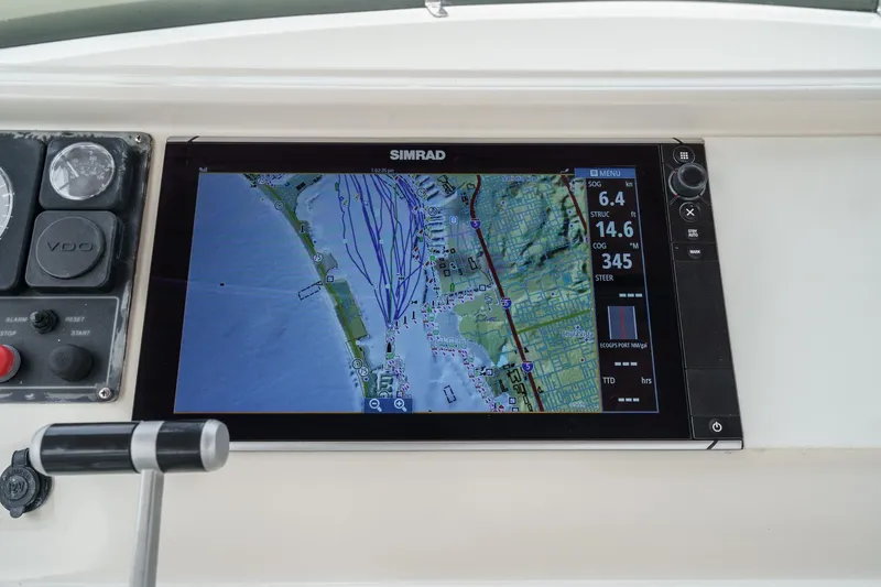 Sweet Seas Yacht Photos Pics Navigation display on 2001 McKinna 57 Pilothouse, showing coastal map and speed data.