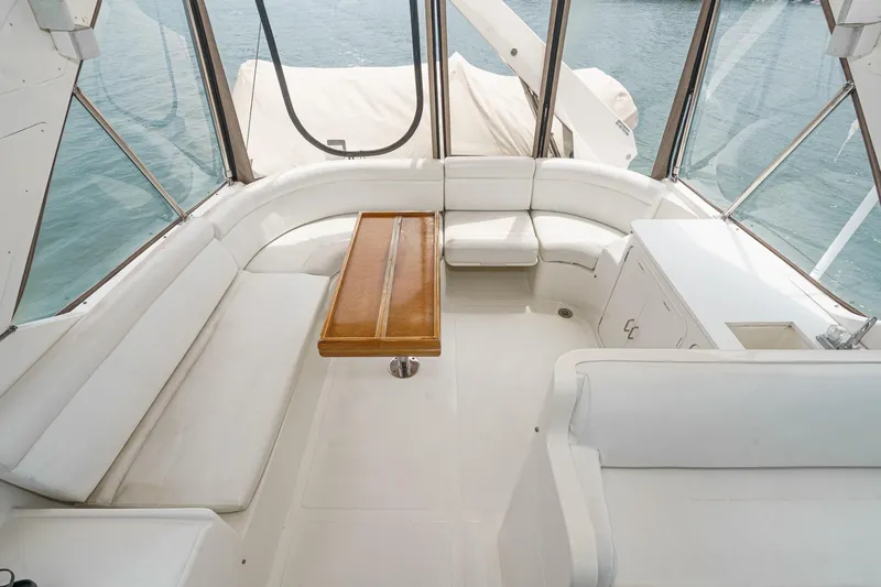 Sweet Seas Yacht Photos Pics Luxurious seating area on a 2001 McKinna 57 Pilothouse yacht with ocean view.