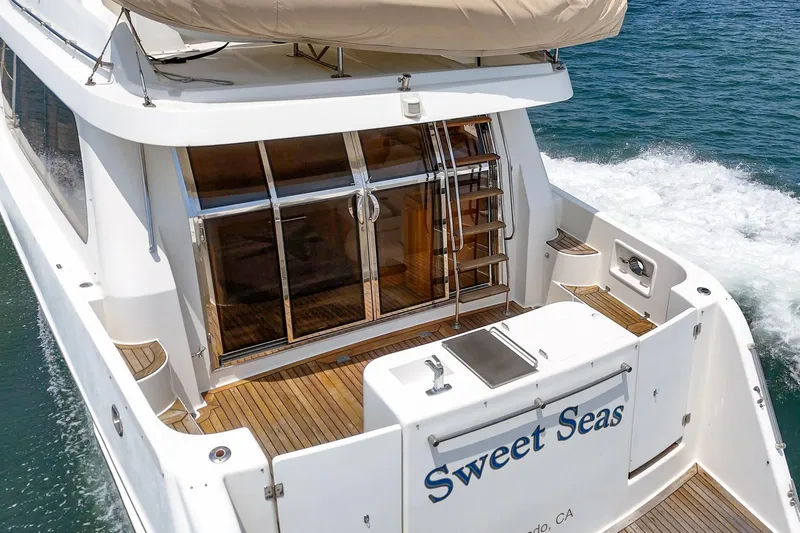 Sweet Seas Yacht Photos Pics 2001 McKinna 57 Pilothouse yacht "Sweet Seas" cruising on open water.