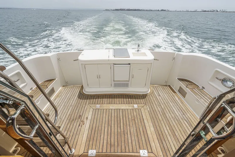 Sweet Seas Yacht Photos Pics 2001 McKinna 57 Pilothouse yacht deck with ocean view and wooden flooring.