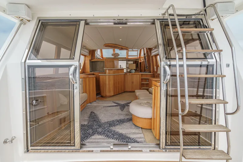 Sweet Seas Yacht Photos Pics Interior view of 2001 McKinna 57 Pilothouse yacht with modern wood finishes.