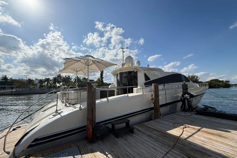  Yacht Photos Pics Luxury Leopard 27m yacht docked under a sunny sky, 2005 model.