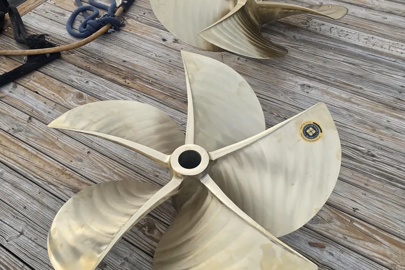  Yacht Photos Pics Propeller of a 2005 Leopard 27m yacht on wooden dock.