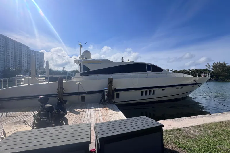  Yacht Photos Pics Luxury 2005 Leopard 27m yacht docked under clear blue sky.