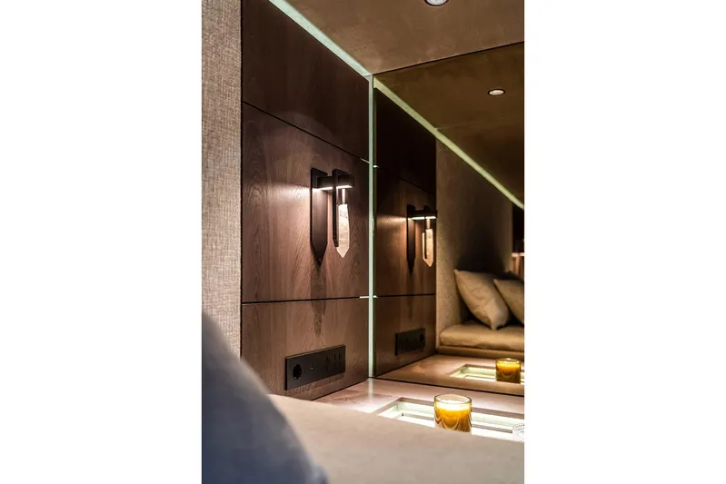  Yacht Photos Pics Luxurious interior of 2026 Sunreef 60 Sunreef Power yacht with modern lighting and cozy seating.