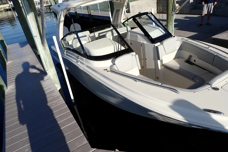  Yacht Photos Pics 2021 Scout 277 Dorado boat docked, featuring sleek design and spacious seating.