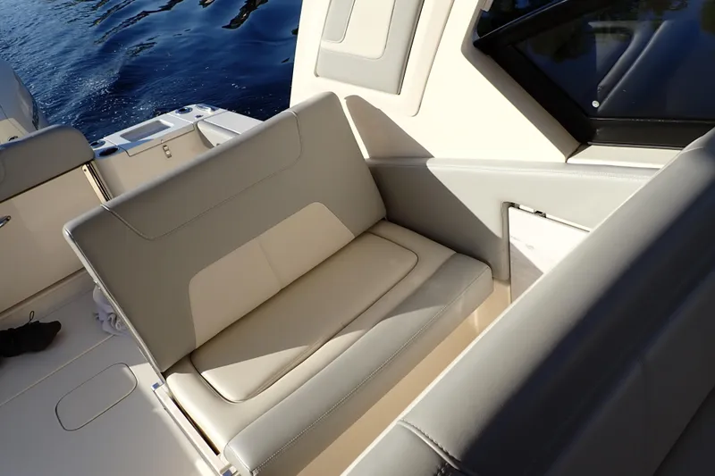  Yacht Photos Pics 2021 Scout 277 Dorado boat interior with beige seating and sleek design.