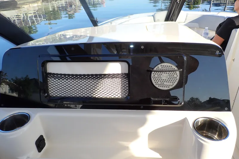  Yacht Photos Pics 2021 Scout 277 Dorado boat dashboard with cup holders and storage net.