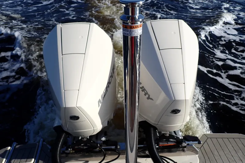  Yacht Photos Pics 2021 Scout 277 Dorado boat with dual Mercury outboard engines on water.