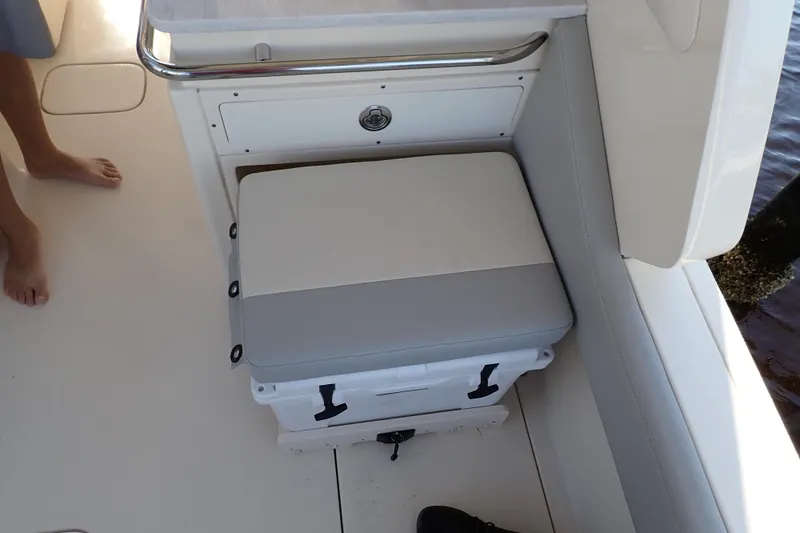  Yacht Photos Pics 2021 Scout 277 Dorado boat seat with integrated cooler, white and gray upholstery.