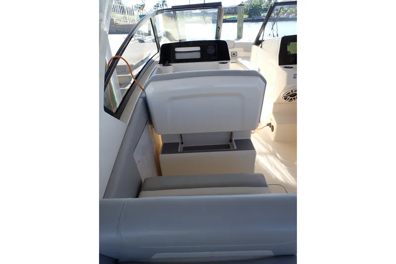  Yacht Photos Pics 2021 Scout 277 Dorado boat interior with seating and dashboard view.