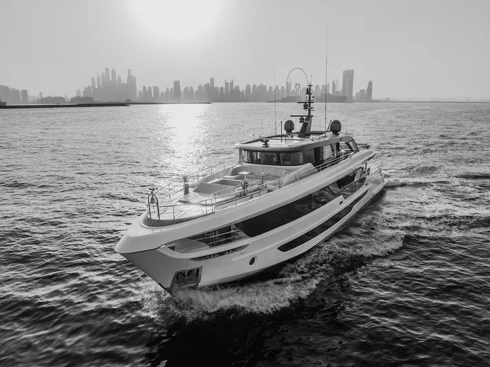  Yacht Photos Pics Majesty 100 Terrace yacht cruising with city skyline backdrop, 2025 model.