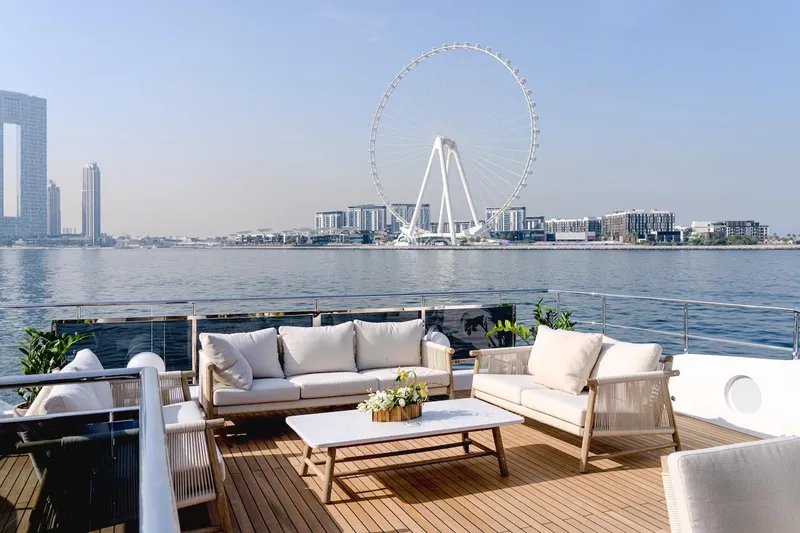  Yacht Photos Pics Luxurious Majesty 100 Terrace yacht deck with cityscape and Ferris wheel view, 2025 model.