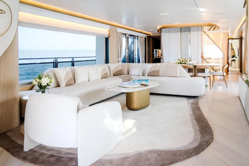 Yacht Photos Pics Luxurious interior of 2025 Majesty 100 Terrace yacht with elegant seating and ocean view.