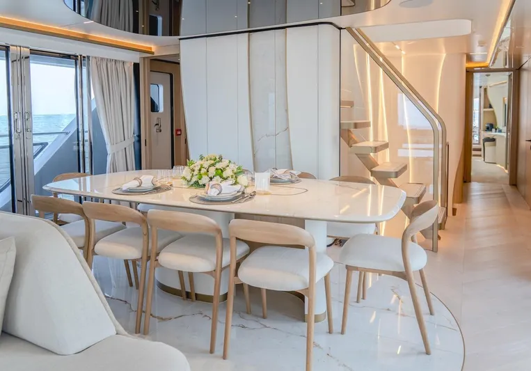  Yacht Photos Pics Luxurious dining area on 2025 Majesty 100 Terrace yacht with elegant decor and modern design.