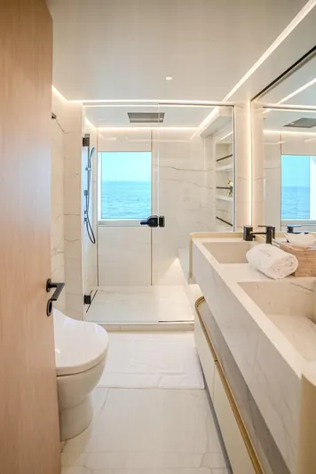  Yacht Photos Pics Luxurious bathroom on Majesty 100 Terrace yacht, 2025 model, featuring modern fixtures and ocean view.