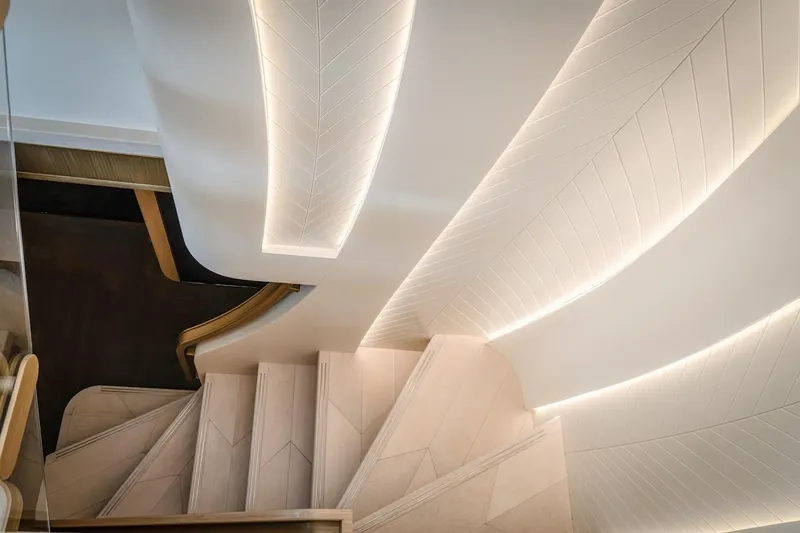  Yacht Photos Pics Elegant staircase with modern lighting on the Majesty 100 Terrace, 2025 model.