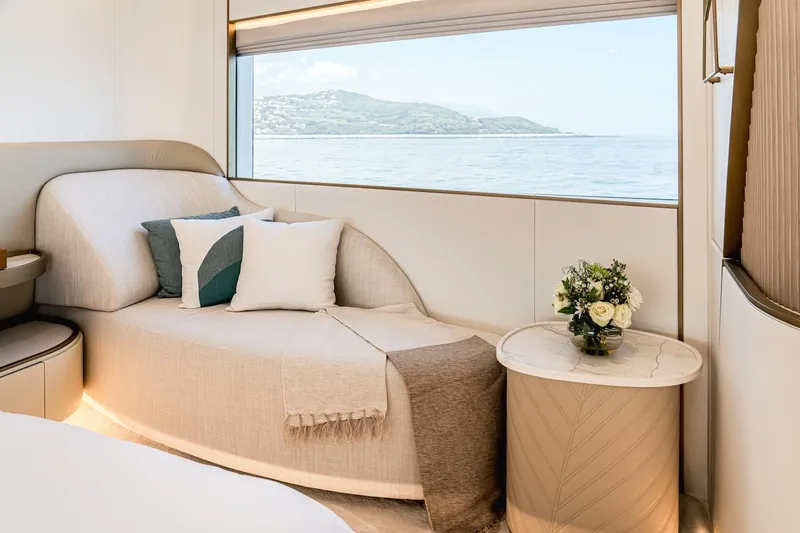  Yacht Photos Pics Luxurious interior of 2025 Majesty 100 Terrace yacht with elegant seating and ocean view.