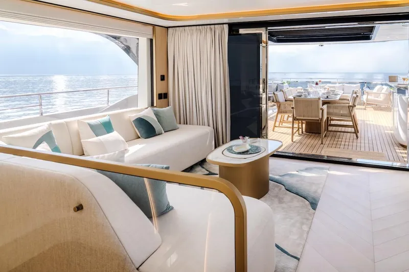  Yacht Photos Pics Luxurious interior of 2025 Majesty 100 Terrace yacht with ocean view and elegant seating.