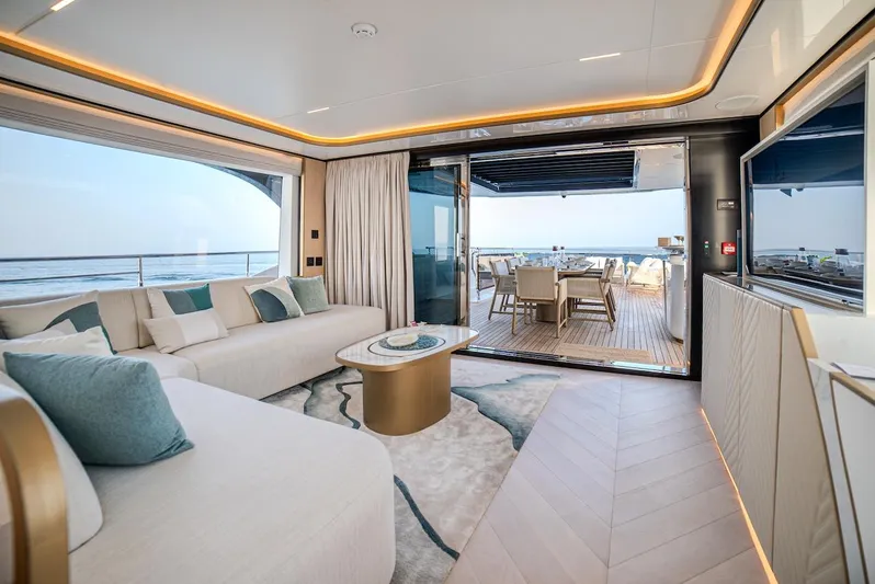  Yacht Photos Pics Luxurious interior of 2025 Majesty 100 Terrace yacht with ocean view.