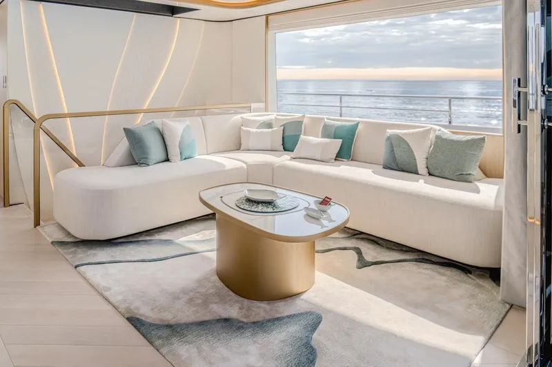  Yacht Photos Pics Luxurious interior of 2025 Majesty 100 Terrace yacht with elegant seating and ocean view.