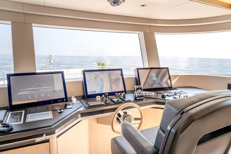  Yacht Photos Pics Modern helm of 2025 Majesty 100 Terrace yacht with advanced navigation systems.