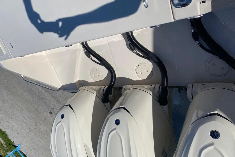  Yacht Photos Pics 2026 Grady-White Canyon 336 boat with triple outboard engines, viewed from above.