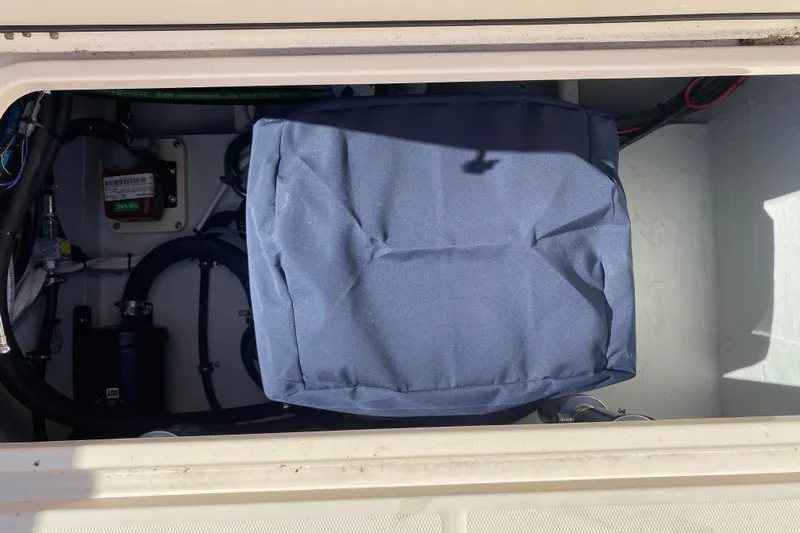  Yacht Photos Pics 2026 Grady-White Canyon 336 boat compartment with covered equipment and wiring.