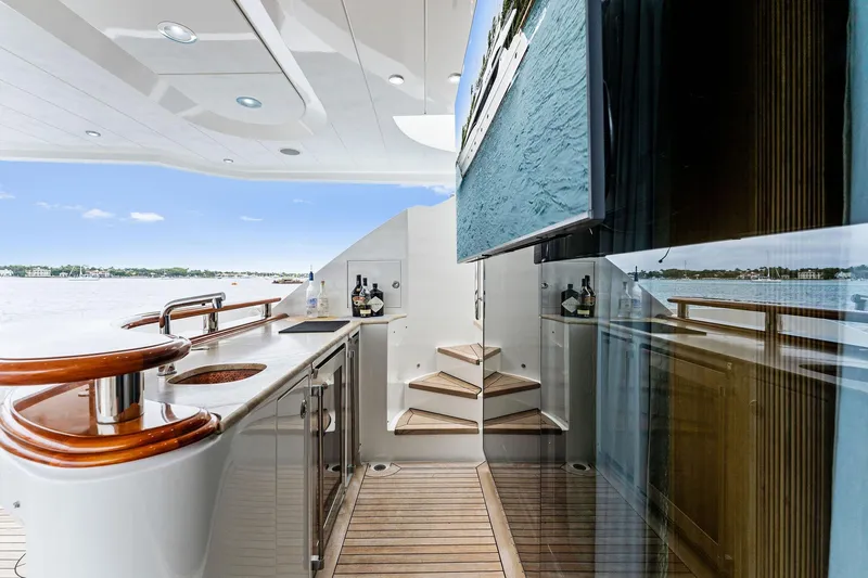 Invictus Yacht Photos Pics Luxurious 2006 Palmer Johnson motor yacht deck with sleek design and elegant wood finishes.