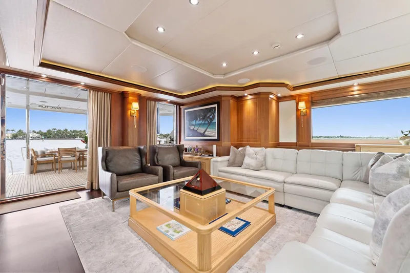 Invictus Yacht Photos Pics Luxurious 2006 Palmer Johnson motor yacht interior with elegant seating and panoramic views.