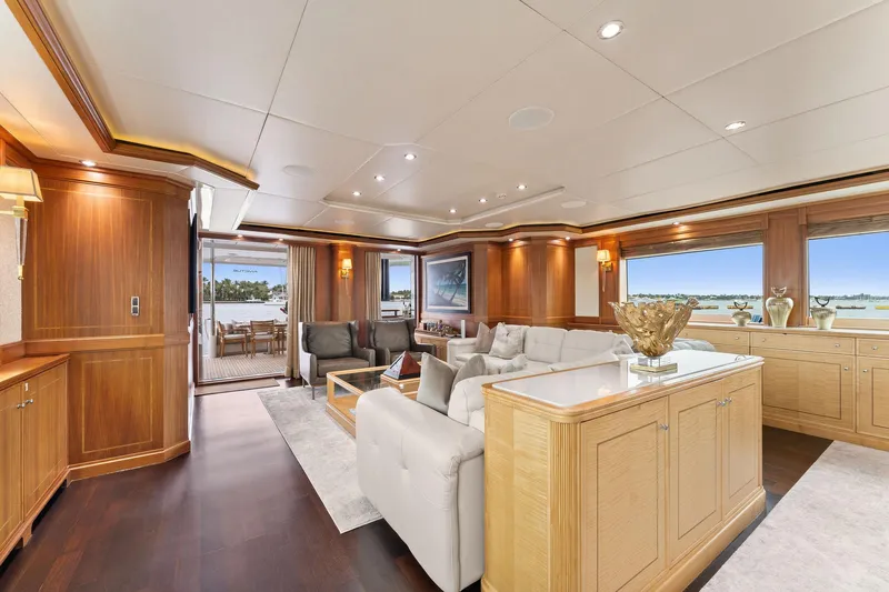 Invictus Yacht Photos Pics Luxurious interior of a 2006 Palmer Johnson motor yacht with elegant wood finishes and spacious seating.