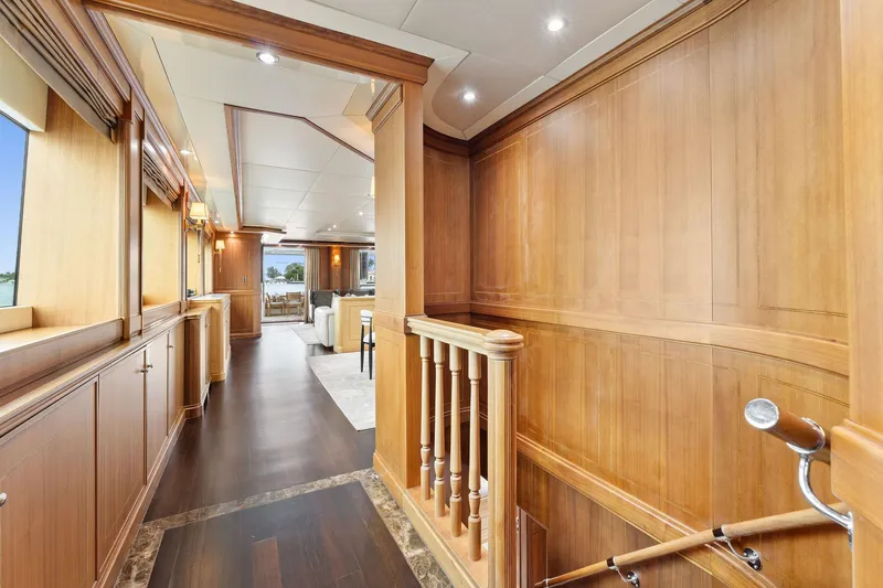 Invictus Yacht Photos Pics Luxurious interior of 2006 Palmer Johnson motor yacht with elegant wood paneling and modern lighting.