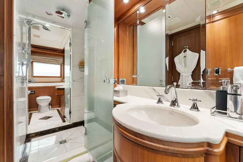 Invictus Yacht Photos Pics Luxurious bathroom on 2006 Palmer Johnson motor yacht with elegant wood and marble finishes.