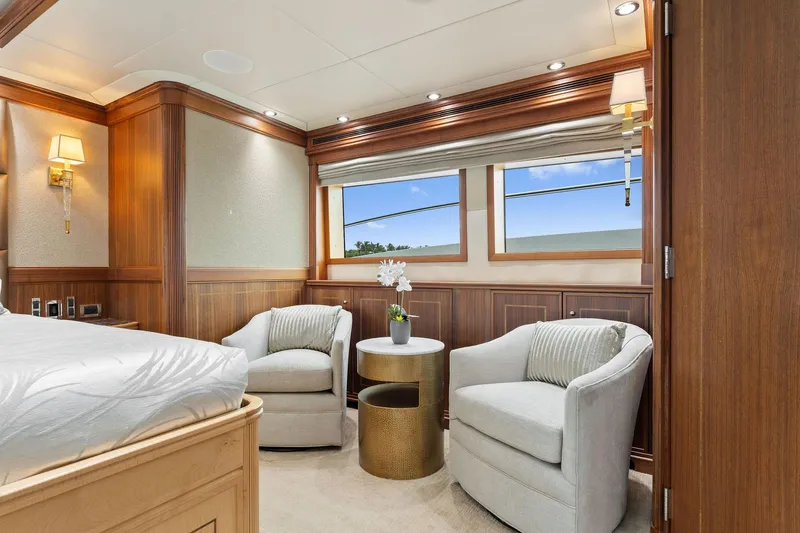 Invictus Yacht Photos Pics Luxurious 2006 Palmer Johnson motor yacht interior with elegant seating and wood paneling.