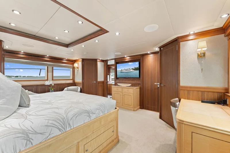 Invictus Yacht Photos Pics Luxurious 2006 Palmer Johnson motor yacht bedroom with elegant wood finishes and modern amenities.
