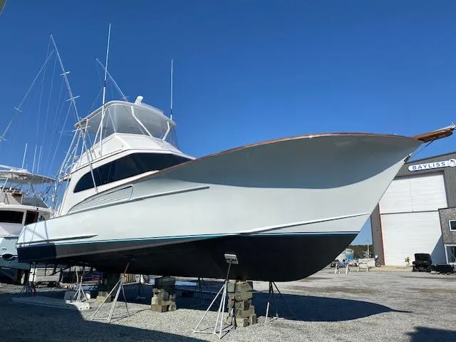 Full Circle Yacht Photos Pics 1984 Custom Carolina Buddy Davis boat on stands in a boatyard.