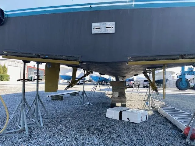 Full Circle Yacht Photos Pics 1984 Custom Carolina Buddy Davis boat on stands for maintenance.