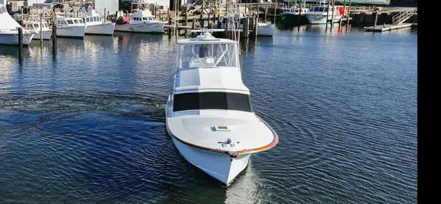 Full Circle Yacht Photos Pics 1984 Custom Carolina Buddy Davis boat in a marina.
