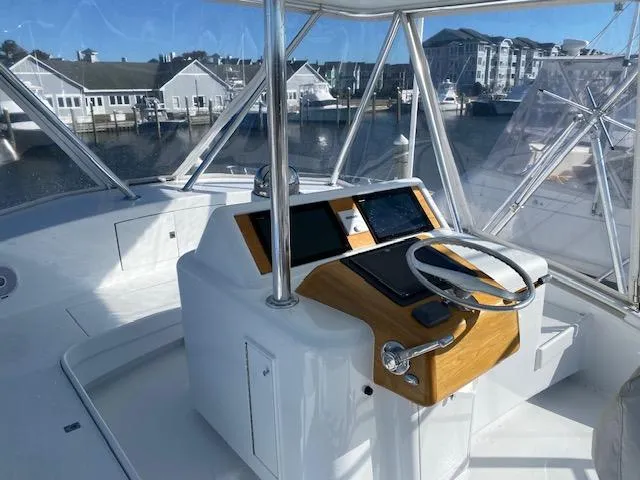 Full Circle Yacht Photos Pics 1984 Custom Carolina Buddy Davis boat helm with modern navigation equipment.