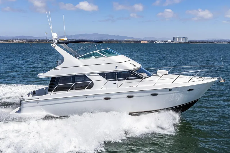 Kathy's Dream Yacht Photos Pics 2000 Carver 450 Voyager Pilothouse yacht cruising on open water.