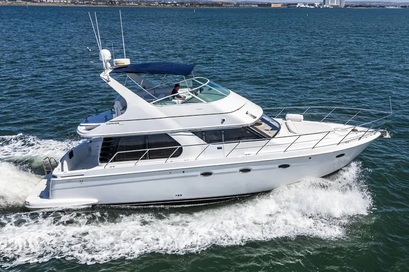 Kathy's Dream Yacht Photos Pics 2000 Carver 450 Voyager Pilothouse yacht cruising on open water.
