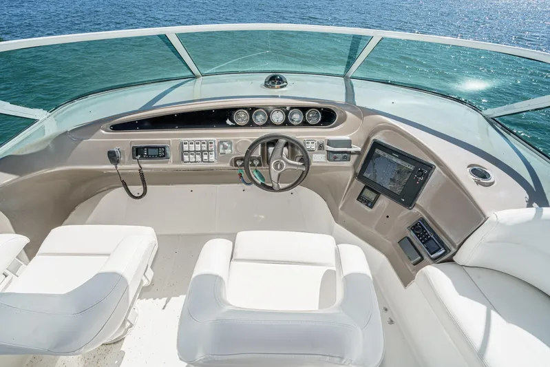 Kathy's Dream Yacht Photos Pics Pilothouse of 2000 Carver 450 Voyager, featuring modern controls and ocean view.