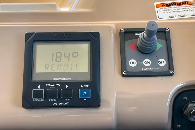 Kathy's Dream Yacht Photos Pics Autopilot controls on 2000 Carver 450 Voyager Pilothouse, featuring Simrad Robertson AP11.